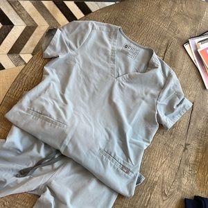 Figs 2 pocket top in small I think the color is dusty blue and Livingston pant